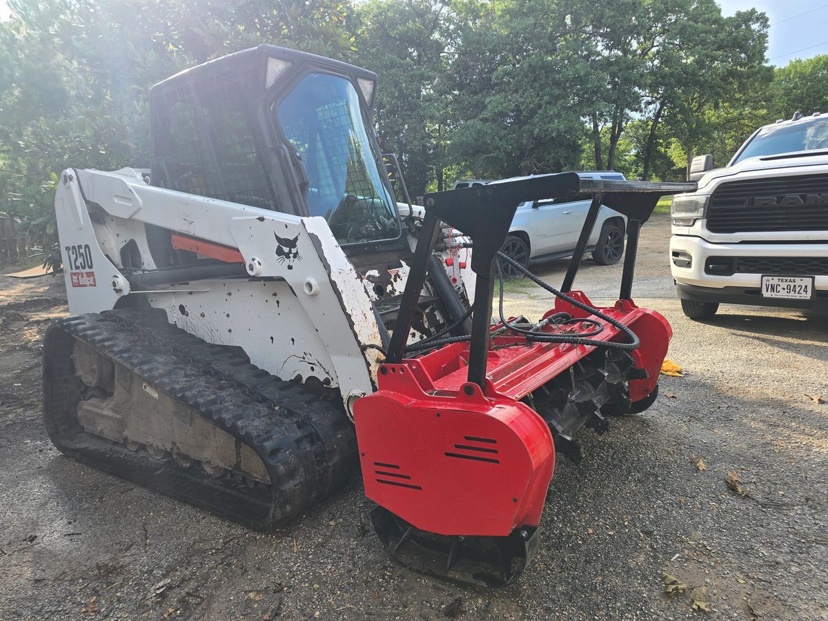Bobcat track loader with mulcher head